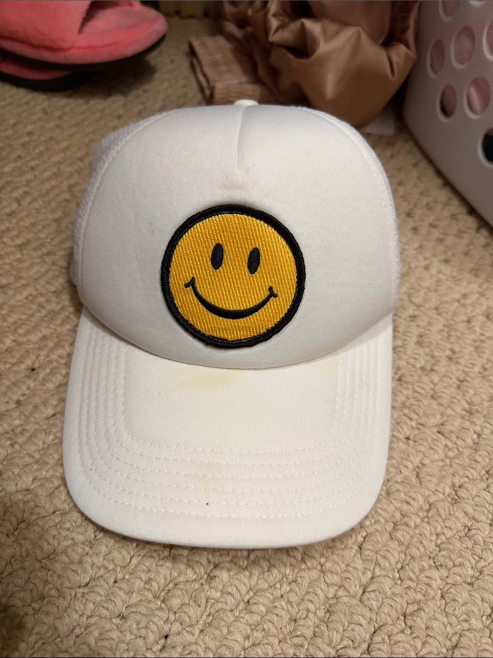 White Trucker Hat with Yellow Smiley Patch